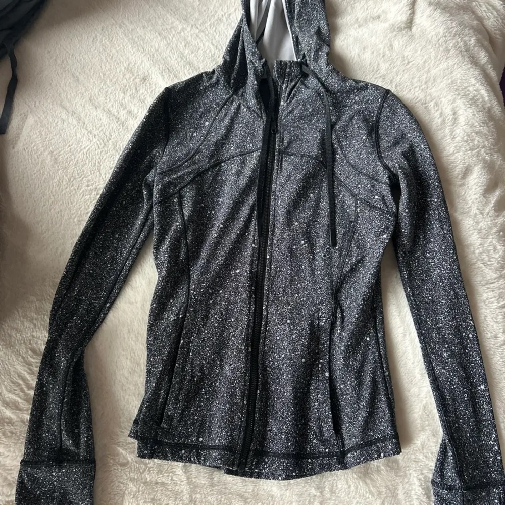 Lululemon Athletica Black and White Jackets with Modern Elegance